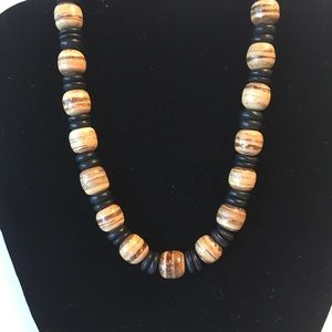 Brown and black beaded necklace on elastic string